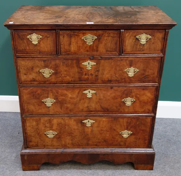 A William and Mary featherbanded walnut chest of three short and three long graduated drawers, on later bracket feet, 81cm wide.