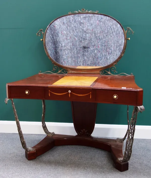 An early 20th century mahogany and silvered bronze dressing table by Raymond Subes, 121cm wide.