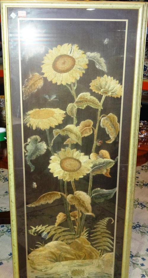 A group of three framed and glazed tapestries.