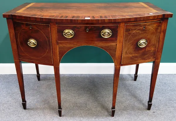 A George III mahogany bowfront side table, with three frieze drawers, on tapering square supports, 123cm wide.