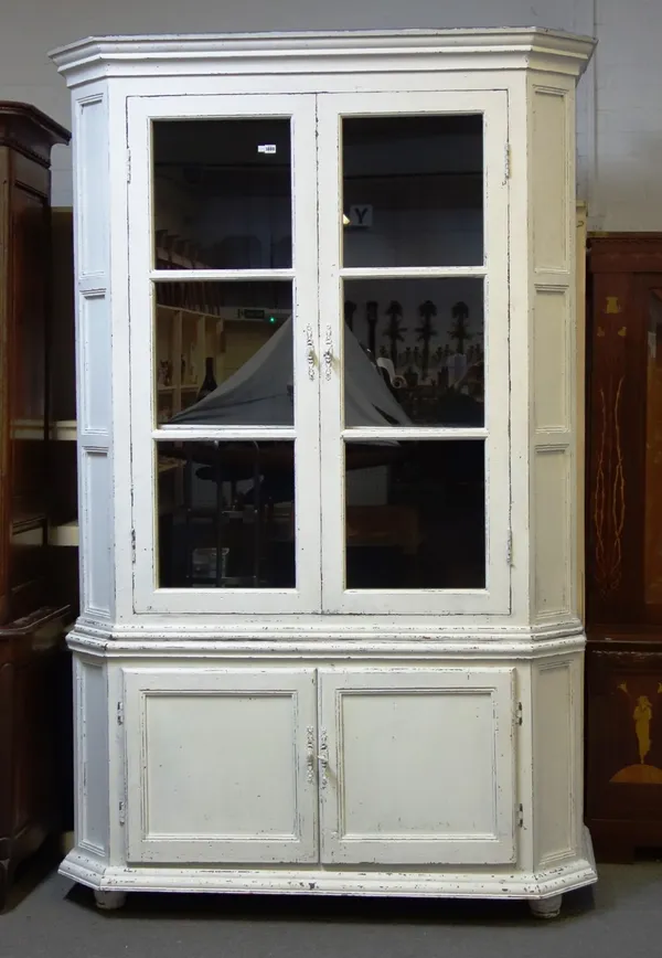 A 19th century and later white painted French display cabinet cupboard, the pair of glazed doors over pair of cupboards, on bun feet, 163cm wide x 255