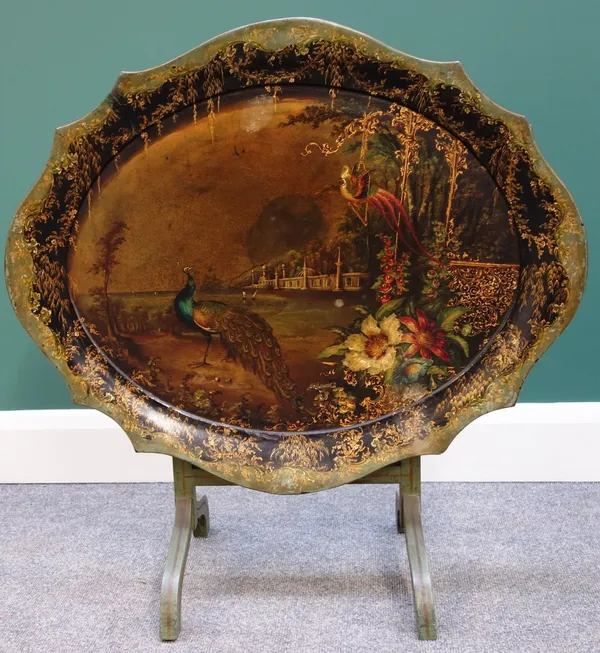 A Victorian papier mache tray painted with peacocks in a landscape, stamped 'Jennens & Bettridge Brimm & London' on later green painted folding stand,