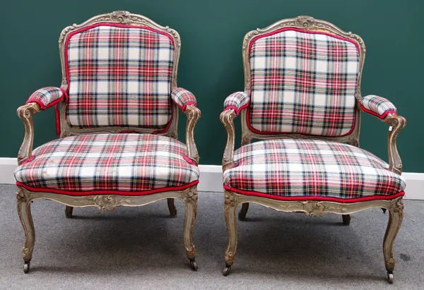 A pair of Louis XV style grey painted tartan upholstered fauteuils, the serpentine seat on cabriole supports.