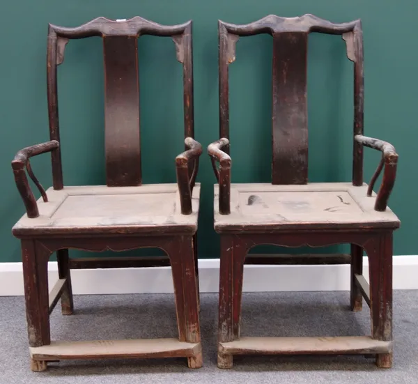 A pair of late 19th/early 20th century Chinese hardwood yoke back chairs, with solid seats and shaped supports.