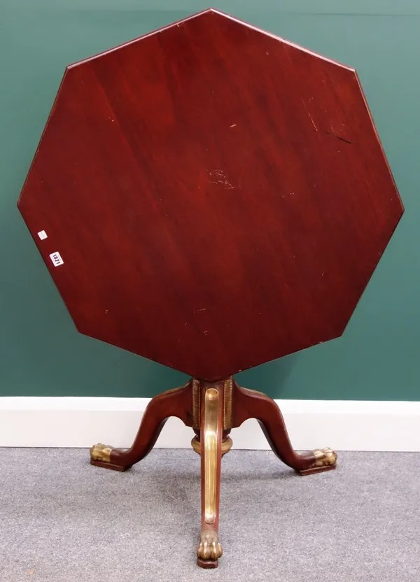 A 19th century Russian gilt metal mounted mahogany occasional table, the snap hexagonal top on tripod base and paw feet, 90cm wide.