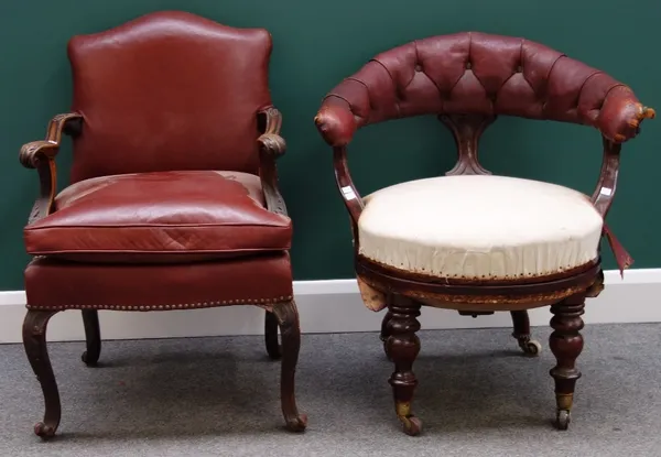 A 19th century French red leather upholstered mahogany framed open armchair, together with a similar tub chair. (2)