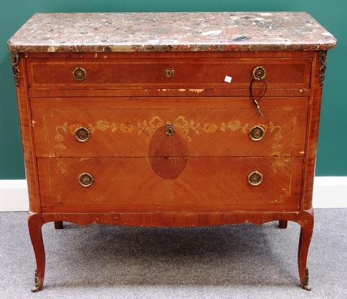 A late 19th century Italian gilt metal mounted marquetry inlaid commode, the marble top over three long graduated drawers, on cabriole supports, 99cm