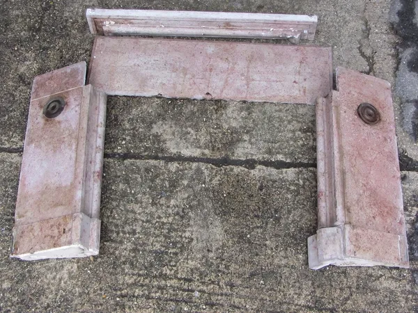 A 19th century French pink marble fire surround, 125cm wide x 100cm high, the aperture 91cm wide x 81cm high.