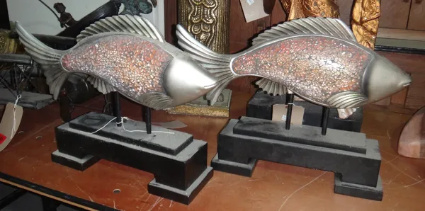 A pair of 20th century wooden painted and glass scale effect fish, on black stands.
