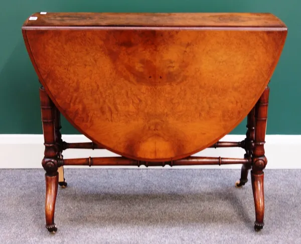 A Victorian figured walnut Sutherland table on turned supports, 85cm wide.