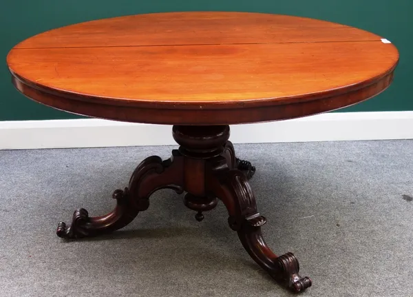 A Victorian mahogany circular snap top breakfast table on turned column and three scroll supports, 128cm wide.