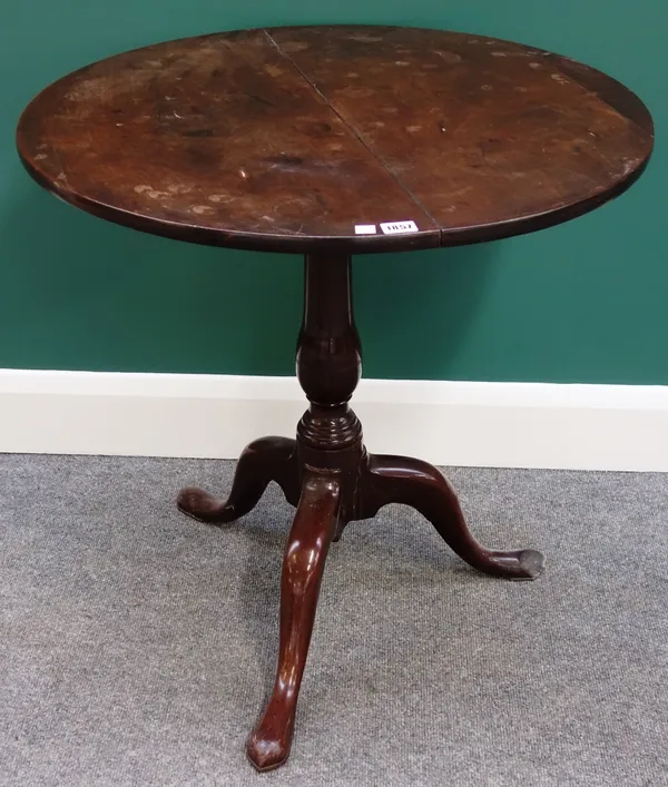 A George III rosewood and mahogany occasional table, the circular snap top on a tripod base, 72cm wide.