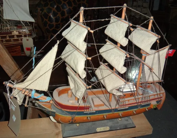 A 20th century wooden model of H.M.S Bounty, together with another boat, 'Grand Turk'.