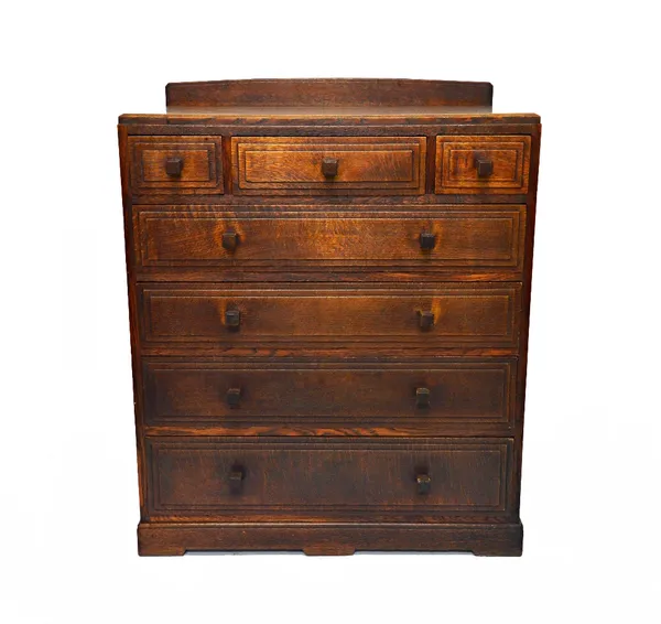 A 20th century oak chest of three long over four long graduated stepped moulded drawers, on stepped plinth base, with maker's plaque 'Brynmawr Furnitu