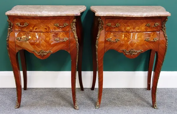 A pair of Louis XV style gilt metal mounted marquetry inlaid kingwood bedside tables, each with serpentine marble top over bombe two drawer base, on s