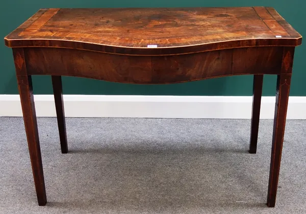 An 18th century inlaid and crossbanded mahogany serpentine serving table on tapering square supports, 108cm wide.