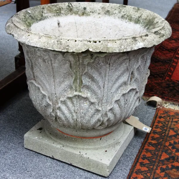 A pair of reconstituted stone jardinieres with acanthus moulded bodies on turned socle together with a Gothic Revival octagonal planter, 53cm wide (3)