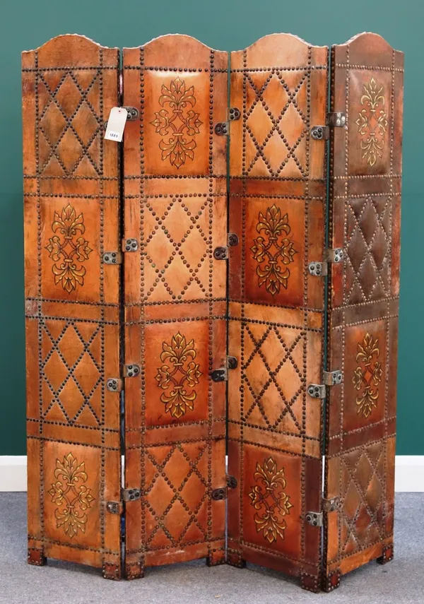 A studded painted leather arch top four fold draught screen, 140cm wide.