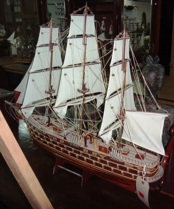 A large wooden model of a war ship.
