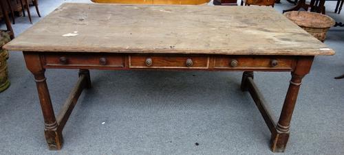 A Victorian pine kitchen table, with three frieze drawers and matching verso, on turned supports, 108cm wide x 178cm long.