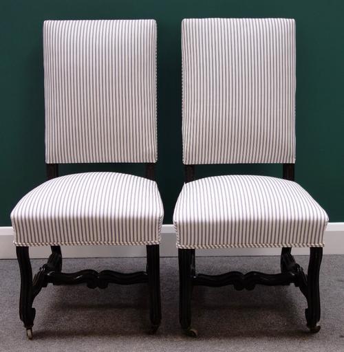 A pair of 17th century Flemish style ebonised square back side chairs on scroll supports.