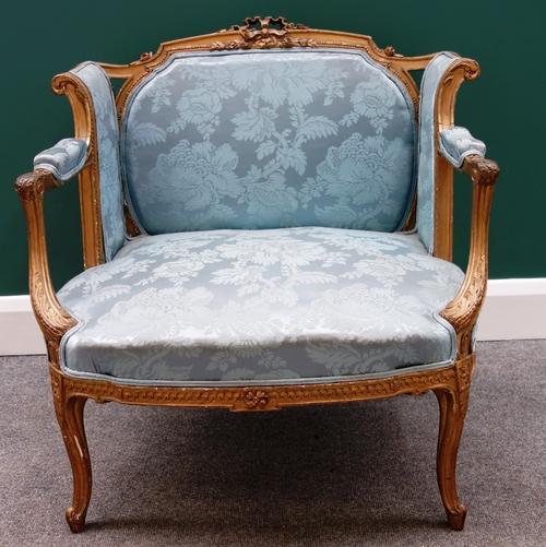 A Louis XV style gilt framed low square back tub chair on slender cabriole supports.