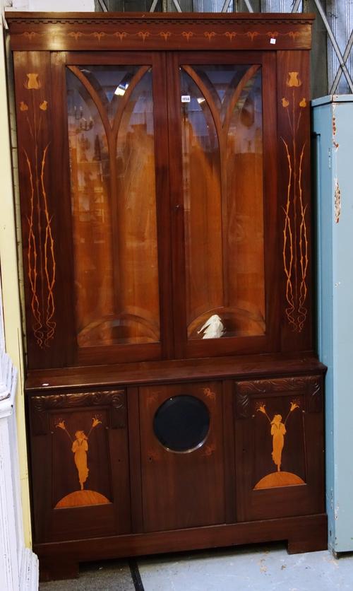 A 19th century Continental marquetry inlaid Art Nouveau display cabinet cupboard, the pair of bevelled glazed doors over three lower doors, the centre
