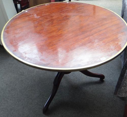 An early 20th century French gilt metal mounted, marquetry inlaid walnut circular three tier etagere, on scroll feet, 84cm high.