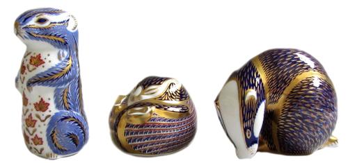 A pair of silver candlesticks, each of Corinthian column form, on a stepped square base, having beaded rims, Sheffield 1890, height 15.5cm.