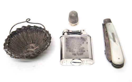 A silver and mother of pearl folding combined Patent Orange Peeler cum fruit knife, Sheffield 1904, a silver plated Dunhill square petrol lighter, wit