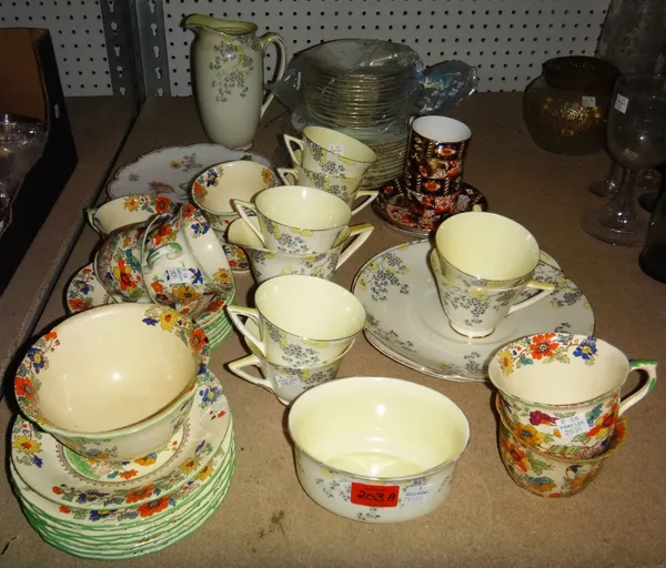 A group of tea wares, including a Royal Doulton Carnival part tea set, a Masons part tea set and two Imari cups and saucers.