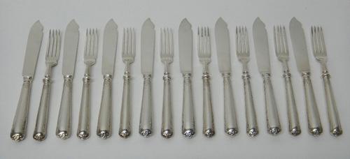 Silver and silver mounted wares, comprising; eight pairs of silver fish knives and forks by Garrard & Co., London, 1958, gross weight 850gms, and a si