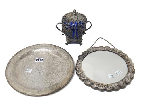 An Egyptian circular dish, with engraved decoration, diameter 25.5cm, weight 341 gms, a filigree twin handled bowl and cover, raised on four feet, wit