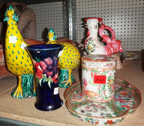 A group of ceramics, including a Moorcroft vase, a pair of Continental models of birds, a faience chicken candlestick, an Oriental storage jar, a tray