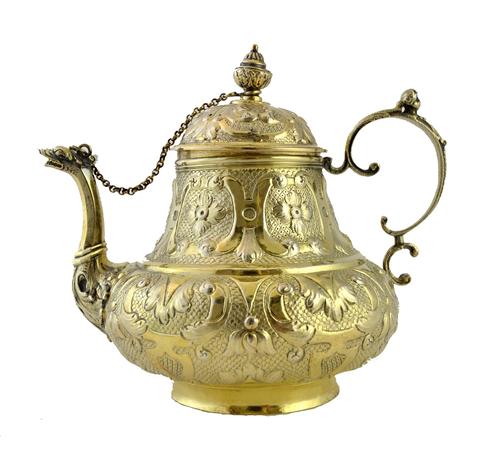 A mid 18th century Dutch silver gilt teapot of pear shaped form, with embossed floral and foliate decoration, Sneek, probably 1761, by Obbe Ydema, gro
