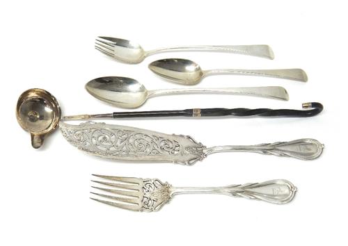 A silver Old English pattern stuffing spoon, London 1805, a silver Old English pattern serving spoon with prongs, London 1799, a silver table spoon, E