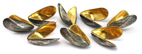 A 19th century gilt convex wall mirror, together with another, a gilt framed wall mirror and a circular mirror with relief fruit motif, (4).