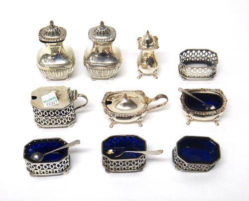 A group of silver condiments, to include; five salt cellars (one lacking liner), three pepperettes and two mustard pots, gross weight of silver 380gms
