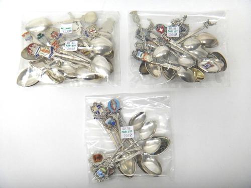 A collection of fifty-five souvenir and town crest spoons, comprising; twenty-two silver examples, twenty-two foreign examples and fifteen plated exam