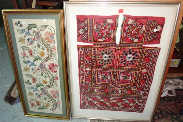 An Eastern textile panel framed and glazed, together with a framed and glazed woolwork panel.