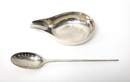A silver pap boat, monogram engraved, London possibly 1748 and a silver large mote spoon, with pierced decoration, with indistinctly struck maker's ma