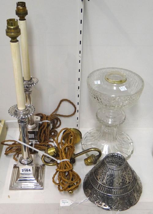A pair of Edwardian plated table lamps, circa 1910, each of classical column form, on a stepped square base, with a pair of plated shades, having pier