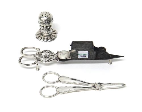 Silver and silver mounted wares, comprising; a pepperette formed as a smiling head, on a shaped circular base, London 1892, a pair of steel scissor ac