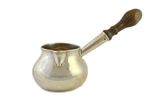 A George II brandy saucepan, of bombe form, fitted with a later wooden handle, the cover lacking, London possibly 1749, maker's mark J.E for John Edwa