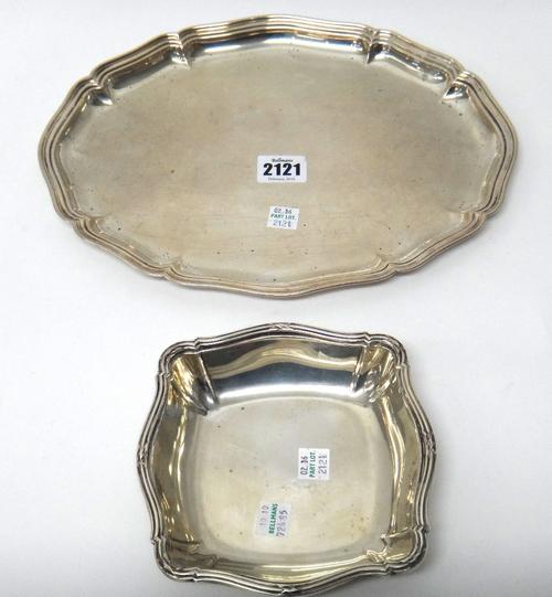 A German shaped oval small serving dish, having a reeded rim, length 30cm, detailed 800 and a German shaped square bonbon dish, having a decorated rim