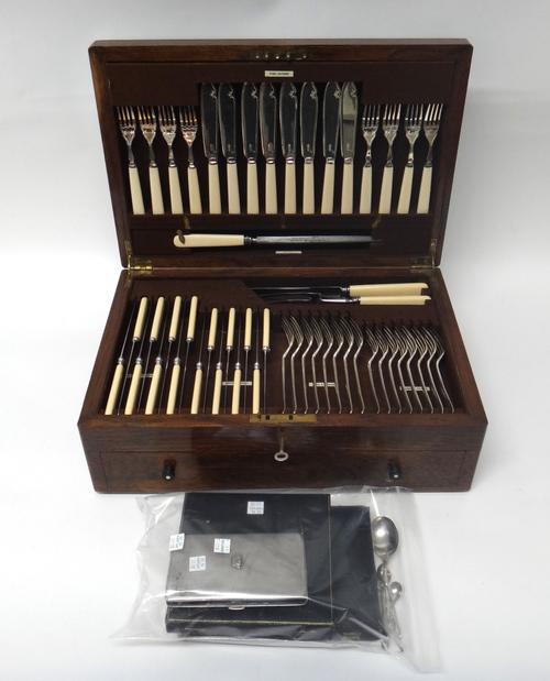 A plated canteen of table flatware, Old English pattern for eight place settings, including fish knives and forks, a three piece carving set, soup spo