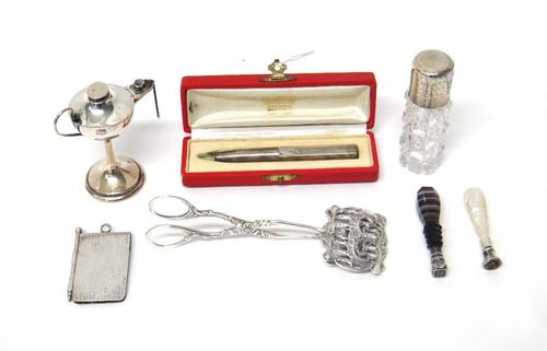 A European table lighter, modelled as an oil lamp, raised on a pedestal detailed 900, a seal having an agate handle, a seal having a mother of pearl h