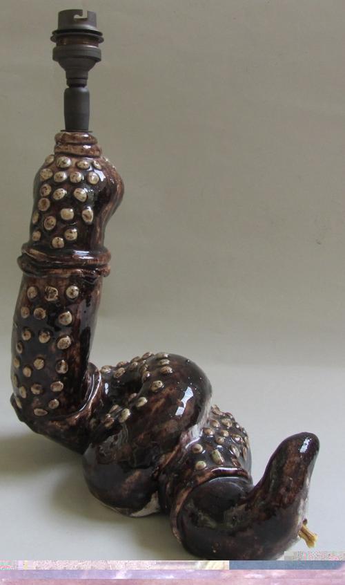 A Royal Copenhagen porcelain vase table lamp, circa 1950, decorated with an orchid against a blue ground, numbered 2640/137, 32cm high.