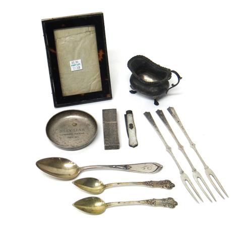 A silver and tortoiseshell mounted rectangular photograph frame, Birmingham 1919, a circular trinket dish, London 1960, a small cream jug, Sheffield 1