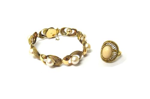 A gold and cultured pearl bracelet, the shaped oval twin section links, centred by cultured pearls, on a snap clasp, detailed K 14, fitted with a safe